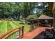 Expansive backyard showcasing the deck, gazebo, and lush lawn, perfect for outdoor activities and relaxation at 3889 Mattingly Dr, Hickory, NC 28602