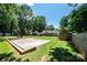Large backyard featuring a concrete patio, play area, and storage shed at 3889 Mattingly Dr, Hickory, NC 28602