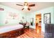 Charming bedroom with hardwood floors, a ceiling fan and neutral color paint at 3889 Mattingly Dr, Hickory, NC 28602