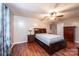 Cozy bedroom featuring hardwood floors, a ceiling fan, and a closet at 3889 Mattingly Dr, Hickory, NC 28602