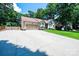 Single-story home with a two-car garage, wide driveway and beautiful landscaping at 3889 Mattingly Dr, Hickory, NC 28602