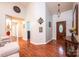 Elegant foyer with hardwood floors, high ceilings, decorative lighting, and a beautiful front door at 3889 Mattingly Dr, Hickory, NC 28602