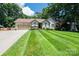 Charming single-story home with a well-manicured lawn and mature trees at 3889 Mattingly Dr, Hickory, NC 28602