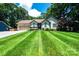 Charming single-story home with a well-manicured lawn and mature trees at 3889 Mattingly Dr, Hickory, NC 28602
