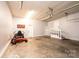 Spacious garage features ample room for storage and vehicles and a stairway to the home's interior at 3889 Mattingly Dr, Hickory, NC 28602