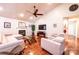 Bright living room featuring hardwood floors, a fireplace, comfortable seating, and a large TV at 3889 Mattingly Dr, Hickory, NC 28602