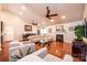 Open-concept living room with hardwood floors, fireplace, and vaulted ceiling at 3889 Mattingly Dr, Hickory, NC 28602