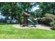 Backyard playground with a slide, climbing structure, and wood chip base at 3889 Mattingly Dr, Hickory, NC 28602