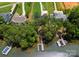 Aerial view features homes with long drives, lush landscaping, and private docks along a tree-lined waterfront at 4069 Rivendell Rd, Denver, NC 28037