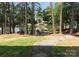 Lush backyard leading to a tranquil lake with a private dock, offering direct access to the water at 4069 Rivendell Rd, Denver, NC 28037