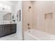 Bright bathroom with a soaking tub and storage niche in shower at 4069 Rivendell Rd, Denver, NC 28037