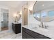 Well-lit bathroom features dual vanities, round mirrors, and modern fixtures at 4069 Rivendell Rd, Denver, NC 28037