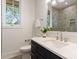 Bathroom featuring a vanity, modern mirror, and tile shower with glass door at 4069 Rivendell Rd, Denver, NC 28037