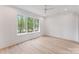 Bright bedroom with a large window view and modern flooring at 4069 Rivendell Rd, Denver, NC 28037