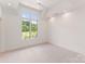 Neutral bedroom with a large window and ceiling fan for comfort at 4069 Rivendell Rd, Denver, NC 28037