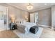 Luxurious bedroom with a comfy bed, gray paneled walls, and ambient lighting at 4069 Rivendell Rd, Denver, NC 28037