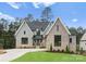Charming two-story home with mixed brick and gray siding, lush lawn, and inviting entrance at 4069 Rivendell Rd, Denver, NC 28037