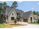 A beautiful two-story house with a gray roof, complementing the exterior paint and brickwork for a classic look at 4069 Rivendell Rd, Denver, NC 28037