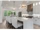 Spacious kitchen features a large island with pendant lighting, stainless steel appliances, and barstool seating at 4069 Rivendell Rd, Denver, NC 28037