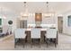 Bright kitchen featuring island with seating, pendant lighting, stainless appliances, and modern white cabinets at 4069 Rivendell Rd, Denver, NC 28037