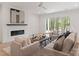 Open living room with a modern fireplace and doors to outside at 4069 Rivendell Rd, Denver, NC 28037
