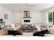 Open living room with a ceiling fan and a modern fireplace at 4069 Rivendell Rd, Denver, NC 28037