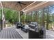 Enjoy this scenic outdoor patio with wooded views and comfortable seating, perfect for relaxing at 4069 Rivendell Rd, Denver, NC 28037