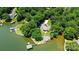 Stunning aerial view of a waterfront property with lush landscaping and private docks at 4485 River Oaks Rd, Lake Wylie, SC 29710