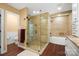 Luxurious bathroom with glass shower, soaking tub, and modern fixtures, creating a spa-like experience at 4485 River Oaks Rd, Lake Wylie, SC 29710