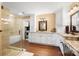Modern bathroom featuring a walk-in shower, separate tub, granite counters and ample cabinet space at 4485 River Oaks Rd, Lake Wylie, SC 29710