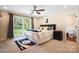 Bedroom with a ceiling fan, large window providing natural light, and a cozy atmosphere at 4485 River Oaks Rd, Lake Wylie, SC 29710