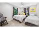 Comfortable bedroom with two twin beds and lots of natural light from large windows at 4485 River Oaks Rd, Lake Wylie, SC 29710