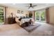 Cozy bedroom with a plush bed, decorative pillows, and natural light streaming through the windows at 4485 River Oaks Rd, Lake Wylie, SC 29710