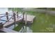 Modern boat dock and ladder for swimming on the lake at 4485 River Oaks Rd, Lake Wylie, SC 29710