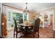 Formal dining room with chandelier and picture window, perfect for entertaining at 4485 River Oaks Rd, Lake Wylie, SC 29710
