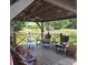 Inside the dock, multiple chair arrangements and views of the water create a relaxing outdoor space at 4485 River Oaks Rd, Lake Wylie, SC 29710