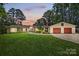 Charming single-story home with a manicured lawn and a three-car garage at 4485 River Oaks Rd, Lake Wylie, SC 29710