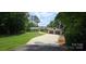 Ranch style home with a spacious driveway, two-car garage, and well-manicured lawn at 4485 River Oaks Rd, Lake Wylie, SC 29710