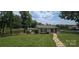 Charming lake house with a stone pathway leading to a private deck and a covered boat dock at 4485 River Oaks Rd, Lake Wylie, SC 29710
