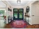 Inviting home entry with decorative rug and statement lighting at 4485 River Oaks Rd, Lake Wylie, SC 29710