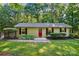 Charming single-story home with a well-manicured lawn and a vibrant red front door at 4485 River Oaks Rd, Lake Wylie, SC 29710