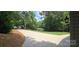 Spacious driveway leading to a charming home with well-maintained lawn, providing a serene, private setting at 4485 River Oaks Rd, Lake Wylie, SC 29710