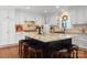 Kitchen features a center island with barstool seating and a stylish granite countertop at 4485 River Oaks Rd, Lake Wylie, SC 29710