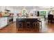 Kitchen with white cabinets and large island and stainless oven at 4485 River Oaks Rd, Lake Wylie, SC 29710