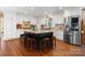 Bright kitchen features a large island with seating, stainless steel appliances, and custom white cabinetry at 4485 River Oaks Rd, Lake Wylie, SC 29710