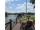 Inviting deck with serene lake views and a covered boat dock, ideal for enjoying waterfront living at 4485 River Oaks Rd, Lake Wylie, SC 29710