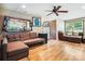 Spacious living room with hardwood floors, comfortable couches, and natural light, ideal for gatherings and relaxation at 4485 River Oaks Rd, Lake Wylie, SC 29710