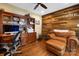 Office featuring custom built-ins, hardwood floors, and a comfortable leather chair at 4485 River Oaks Rd, Lake Wylie, SC 29710