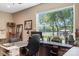 Bright office space featuring a large window with lake views, creating a serene and productive work environment at 4485 River Oaks Rd, Lake Wylie, SC 29710