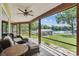 Charming screened porch with comfortable seating and serene lake views, perfect for enjoying the outdoors in comfort at 4485 River Oaks Rd, Lake Wylie, SC 29710